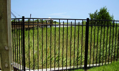EFF-25 fencing sections near a field and dock