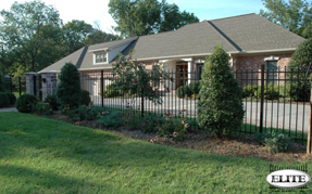 Fenced in driveway with Elite