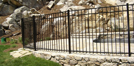Pool fenced-in by EFF-20 style ornamental aluminum fence