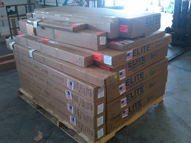 Pallet of Elite aluminum fence sections ready to be shipped