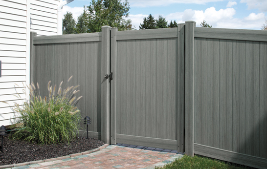 Arctic Blend Vinyl Privacy Fence and Gate with Brick Walkway